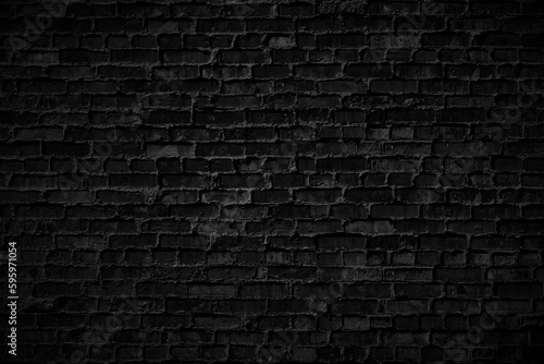 Dark black grunge brick wall texture background with old dirty and vintage style pattern. 