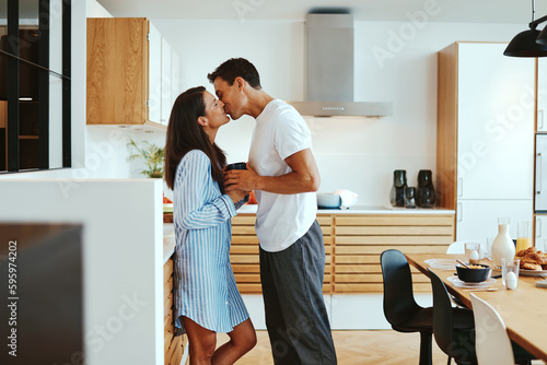 Couple sharing a kiss in the morning