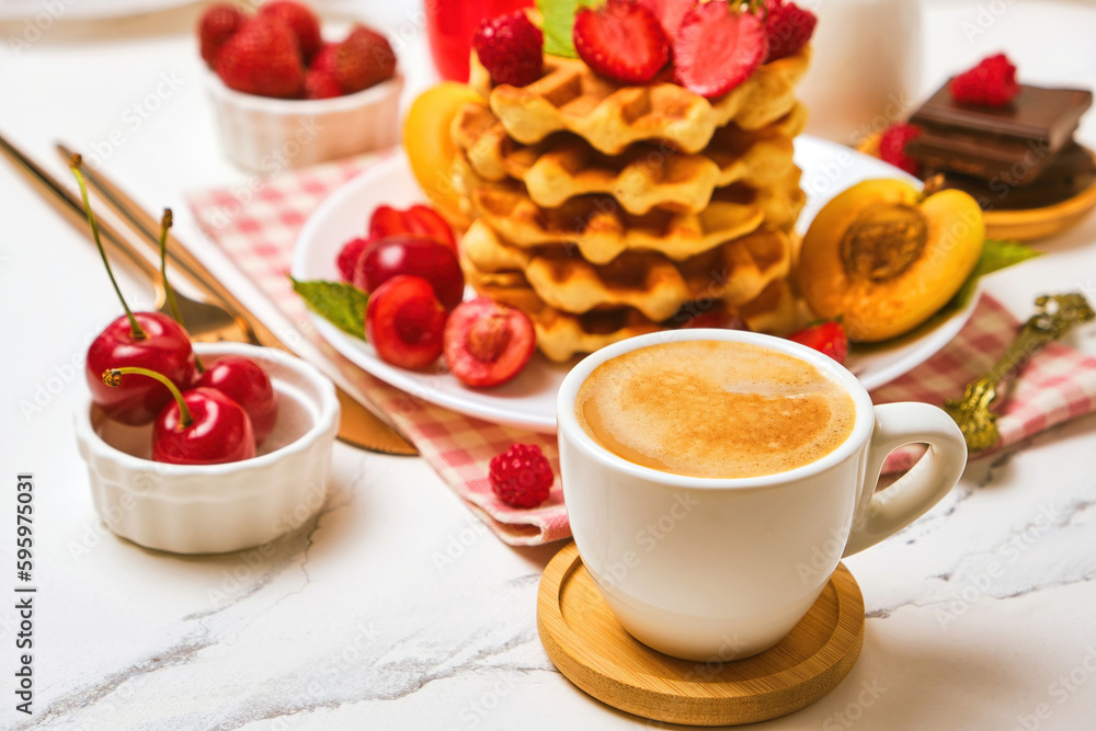 Breakfast table with stack of waffles and fresh berries Breakfast table with stack of waffles and fresh berries