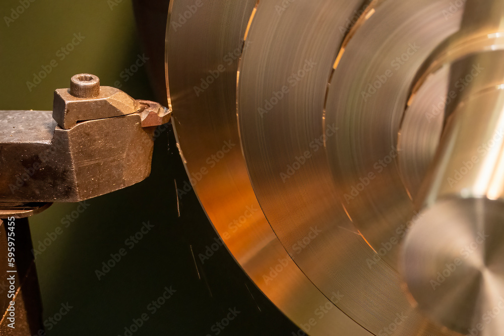 Closeup scene the lathe machine finish cut the brass parts by lathe tools. Closeup scene the lathe machine finish cut the brass parts by lathe tools.