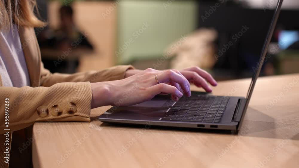 Female hands typing on laptop keyboard, close up. Woman using laptop in office. Online work Female hands typing on laptop keyboard, close up. Woman using laptop in office. Online work