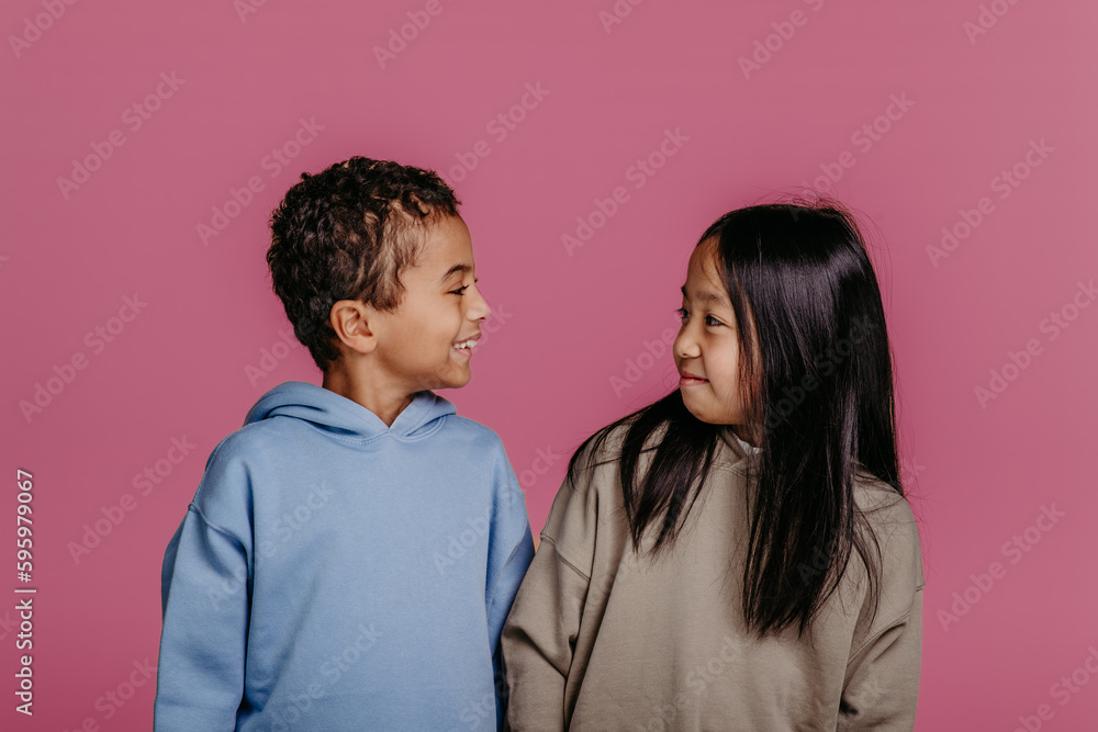 Portrait of two children, studio shoot. Concept of diversity in friendship. Portrait of two children, studio shoot. Concept of diversity in friendship.
