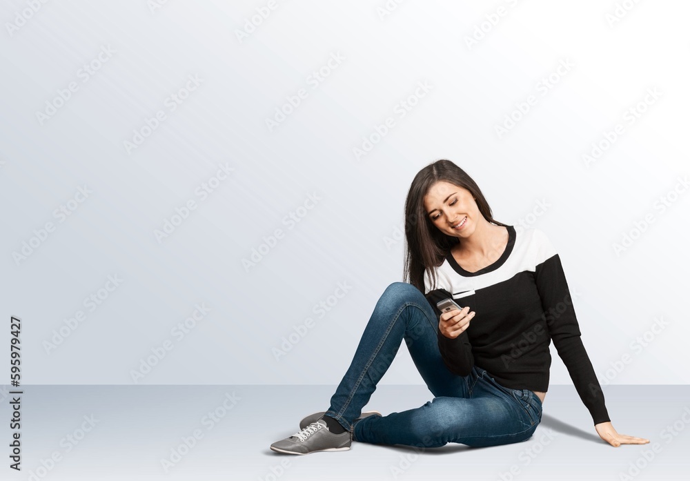 Young cheerful smiling successful woman with phone Young cheerful smiling successful woman with phone