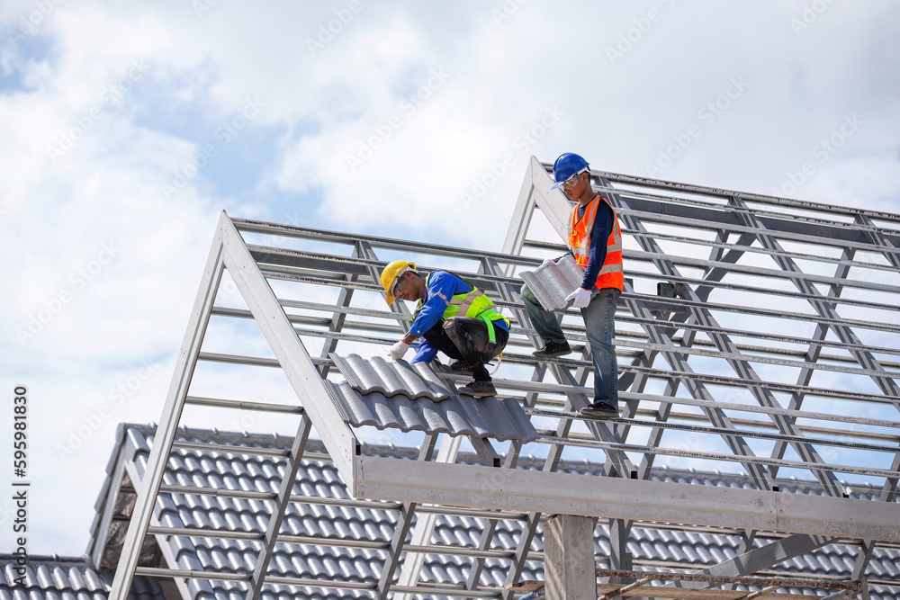 Construction worker working on roof structure, concept of housing construction industry
