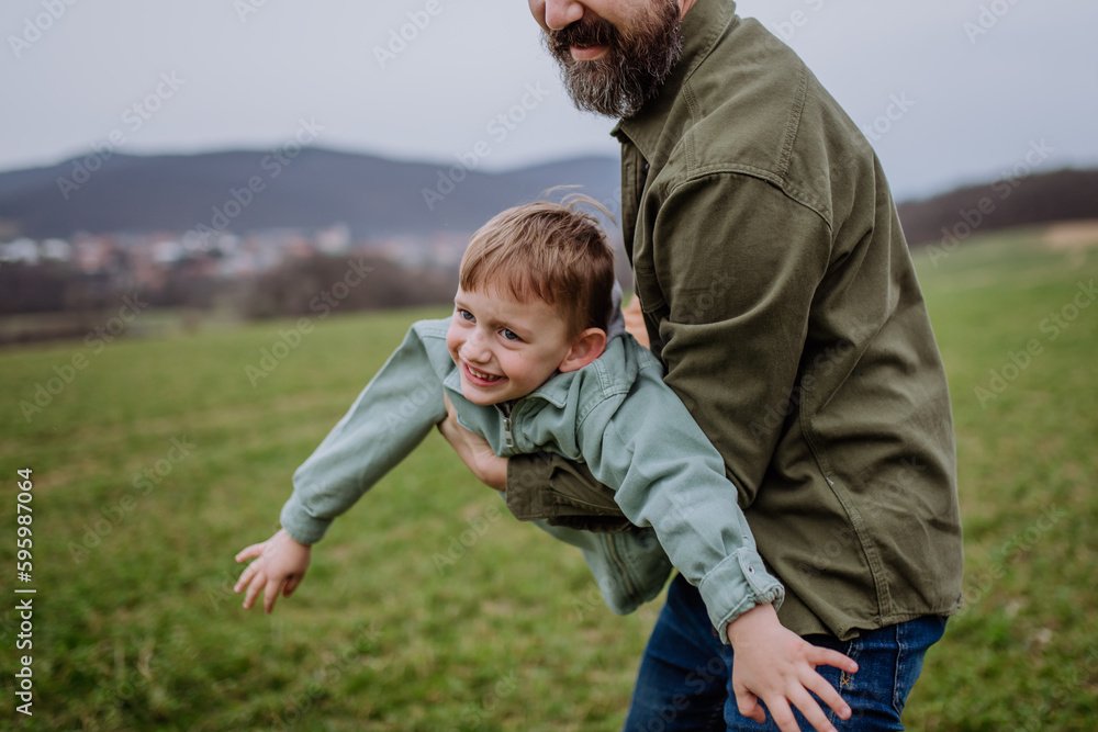 Father and his little son on a walk in nature. Father and his little son on a walk in nature.