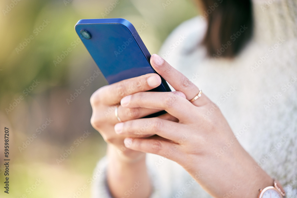 Ill do a quick search online. a woman using her cellphone while standing outside.