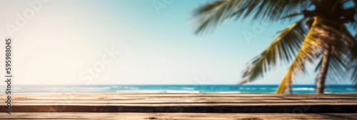 Empty wood table in front of blue sky on summer sea with palm leaf blurred bokeh background concept image for product