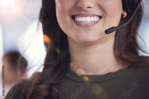 A smile thats ready to provide the best service. an unrecognizable call center agent at work.