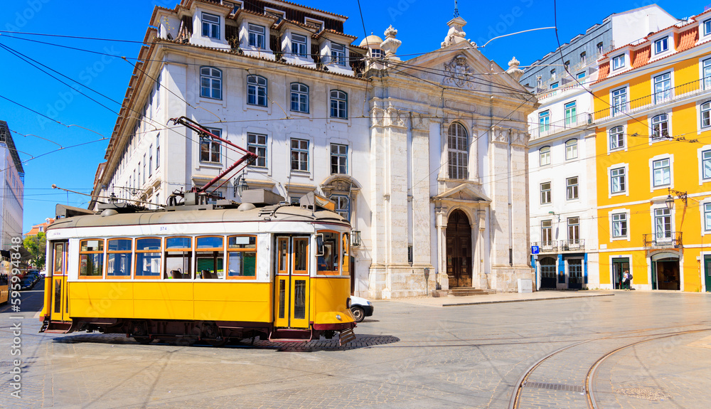 yellow tram in street of  Lisbon, Portugal, retro toned - obrazy, fototapety, plakaty 