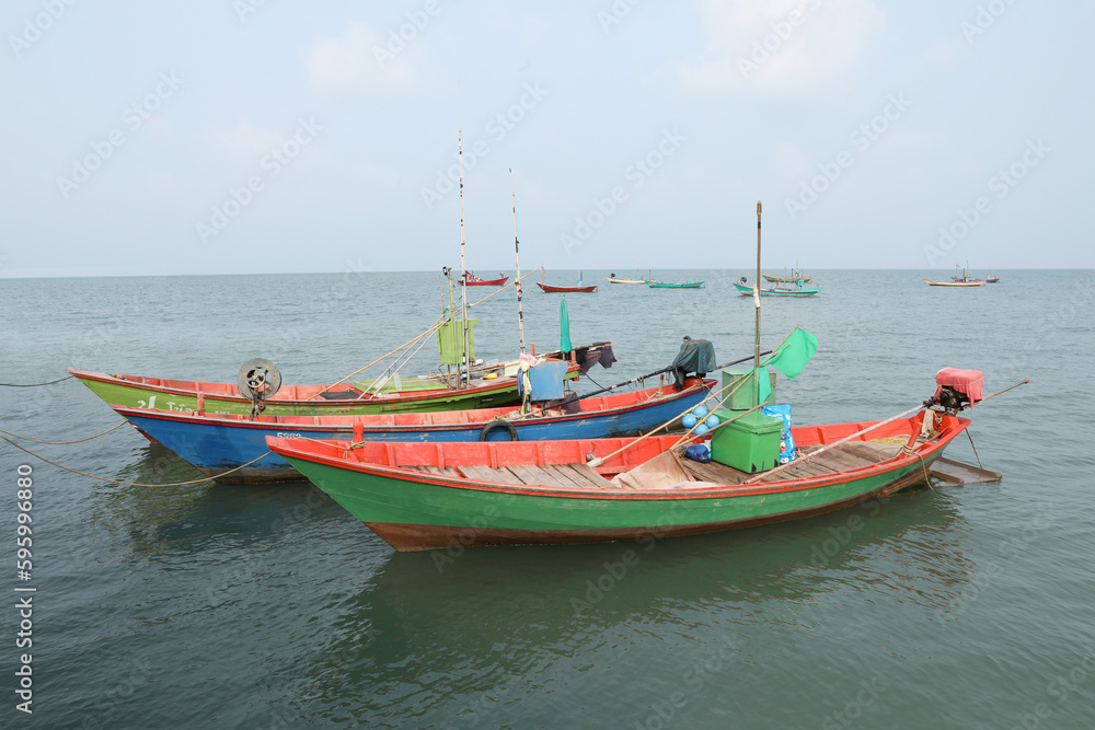 Colorful fishing boat floating on the sea.
