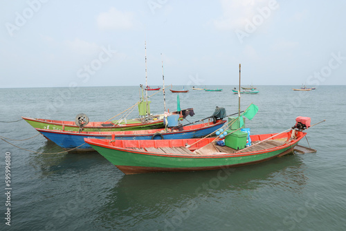 Colorful fishing boat floating on the sea.