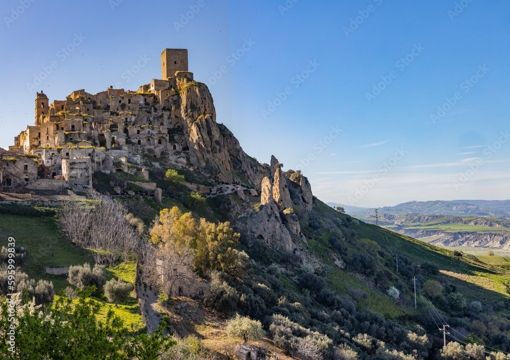 Craco, Basilicata. Abandoned city. A ghost town built on a hill and abandoned due to geological problems. Surreal look, horror film scenery. Panorama of the Calanchi Park. Craco, Basilicata. Abandoned city. A ghost town built on a hill and abandoned due to geological problems. Surreal look, horror film scenery. Panorama of the Calanchi Park.