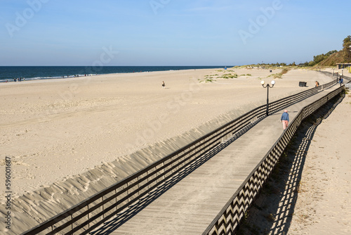 Wooden promenade along the Baltic Sea coas. Yantarny. Kaliningrad region. Russia photo