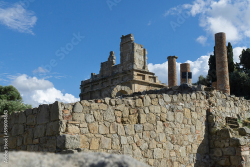 Basilica of tindari building greek roman building style with stone wall on sunny day photo