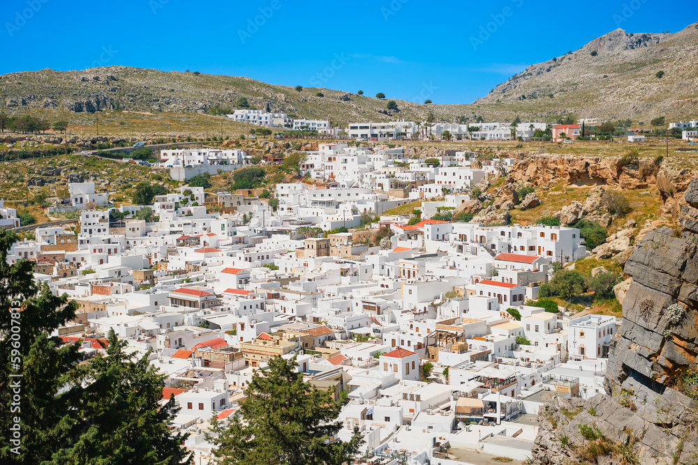 View of the city of Lindos from the Acropolis, Rhodes island, Greek islands of the Dodecanese archipelago, Europe. Holidays and travel around the islands View of the city of Lindos from the Acropolis, Rhodes island, Greek islands of the Dodecanese archipelago, Europe. Holidays and travel around the islands
