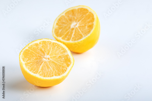 Lemon fruit cut in half, isolated on white background. Lemon cut in half isolated on white background.