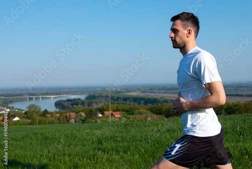 guy facing sideways getting ready for training, nice view, nature, healthy life 
