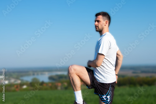 young guy exercising in nature with a beautiful view 