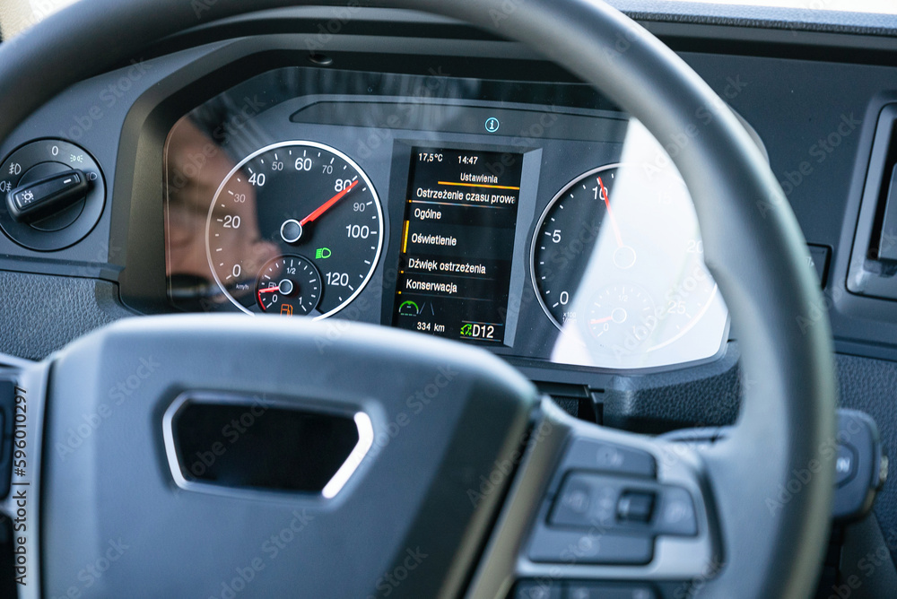View from inside the cab of the truck. The truck is driving down the road. Car transport. View from inside the cab of the truck. The truck is driving down the road. Car transport.