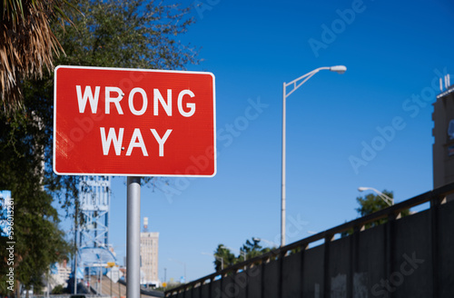 Red and White Wrong Way Road Sign Post photo