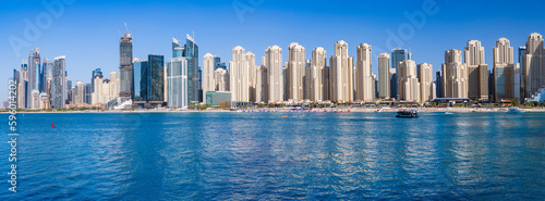 Wide panorama of new apartments among hotels on oceanfront in Jumeirah Beach Residence area of Dubai