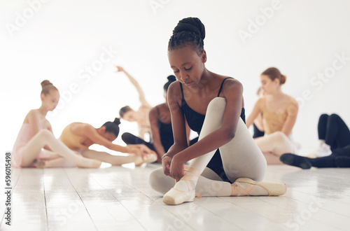 If someone understands, good. If not, no matter. a group of young ballerinas preparing for their routine.