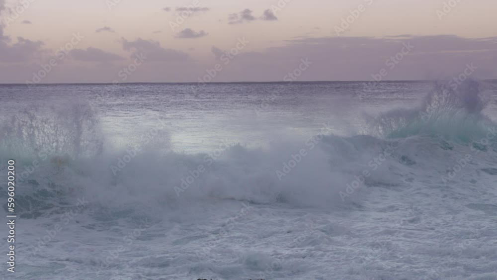Hawaii wild nature, wanderlust tourism USA. Sea waves crashing with splashes, gentle blue dusk evening sky after sunset. Beautiful sea background, slow motion RED camera shot. Rocky beach Oahu island Hawaii wild nature, wanderlust tourism USA. Sea waves crashing with splashes, gentle blue dusk evening sky after sunset. Beautiful sea background, slow motion RED camera shot. Rocky beach Oahu island