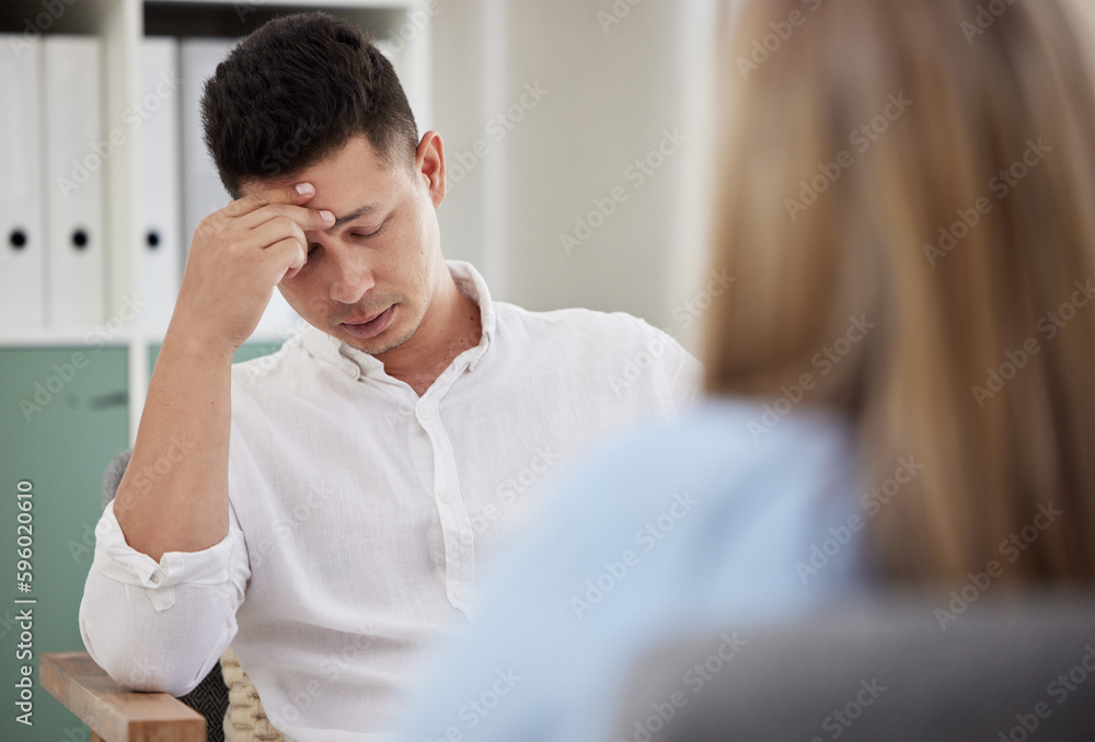 I keep thinking about it. a handsome young man sitting in the clinic with his therapist and feeling stressed. I keep thinking about it. a handsome young man sitting in the clinic with his therapist and feeling stressed.