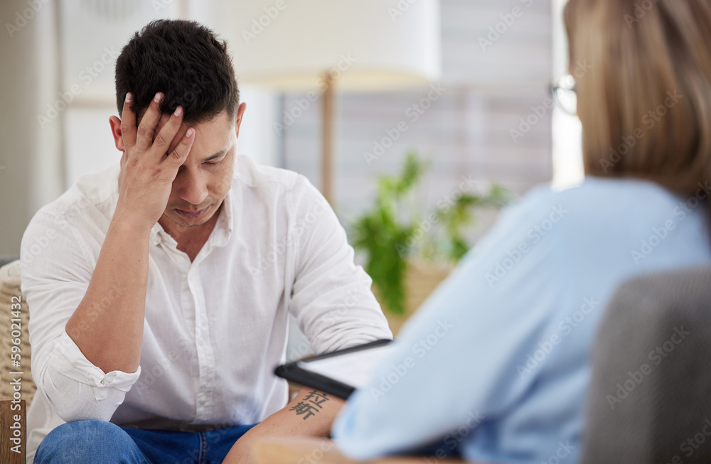 It consumes me. a handsome young man sitting in the clinic with his therapist and feeling stressed. It consumes me. a handsome young man sitting in the clinic with his therapist and feeling stressed.