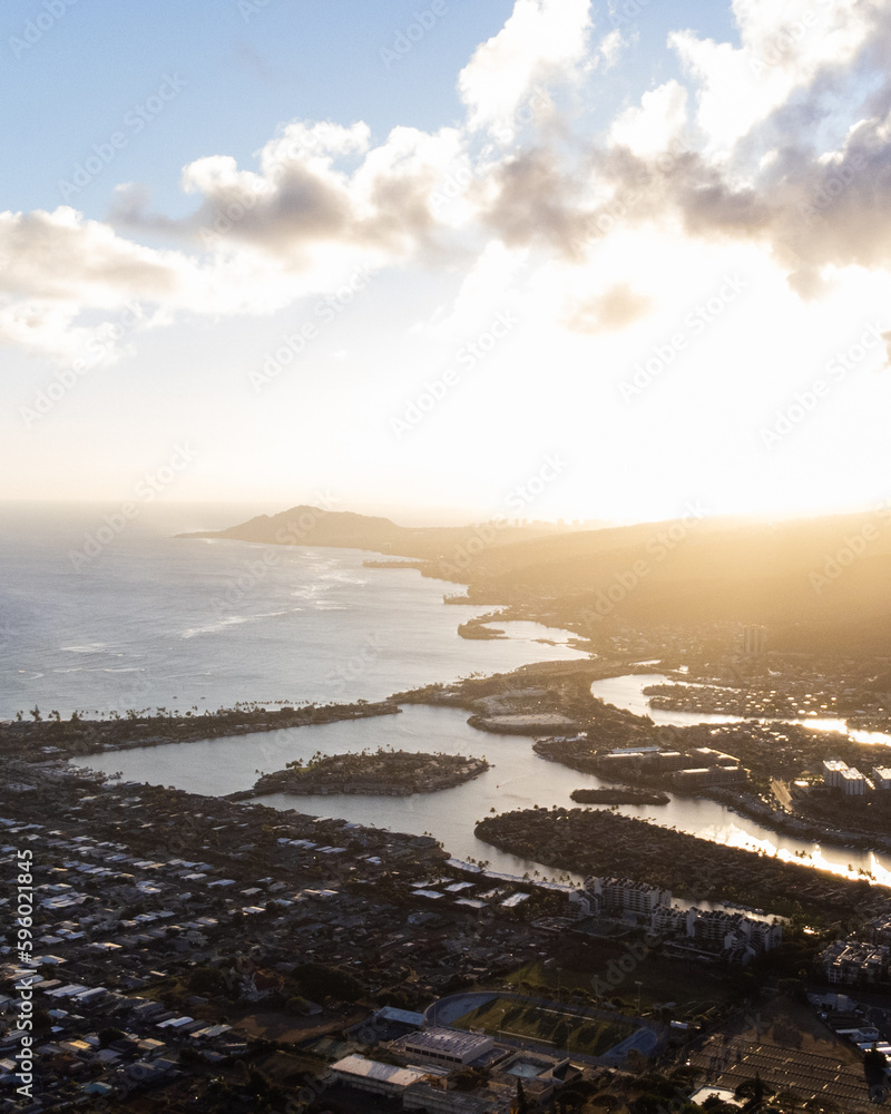 Sunset from top of Koko Head Crater. High quality photo. A railroad track hike up a mountain on Oahu, Hawaii.