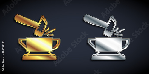 Gold and silver Blacksmith anvil tool and hammer icon isolated on black background. Metal forging. Forge tool. Long shadow style. Vector
