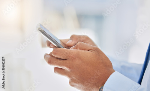 I cant wait to see you. a businessman using his smartphone to send a text message.