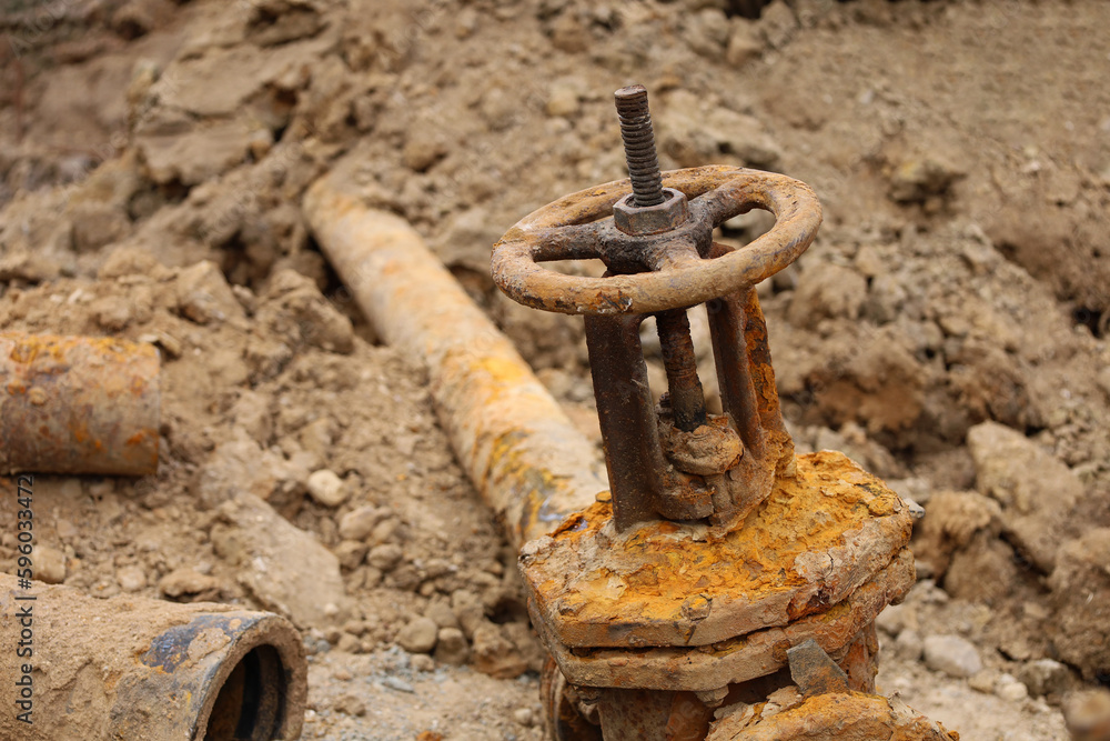 Water pipe replacement. Fragment of old rusty water pipes. Destroyed and corrosion flange and bolt nut on pipeline valve drain industrial. Damage tube. Supplying hot water, heating. Industrial concept Water pipe replacement. Fragment of old rusty water pipes. Destroyed and corrosion flange and bolt nut on pipeline valve drain industrial. Damage tube. Supplying hot water, heating. Industrial concept