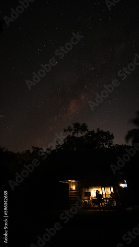 milky way over woods cabin