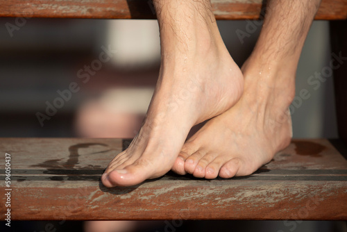 Feet of man on vacation