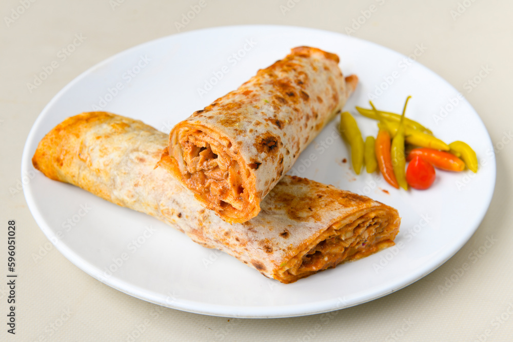 Lavash doner kebab ( zurna doner durum )  or shawarma sliced in plate isolated. 