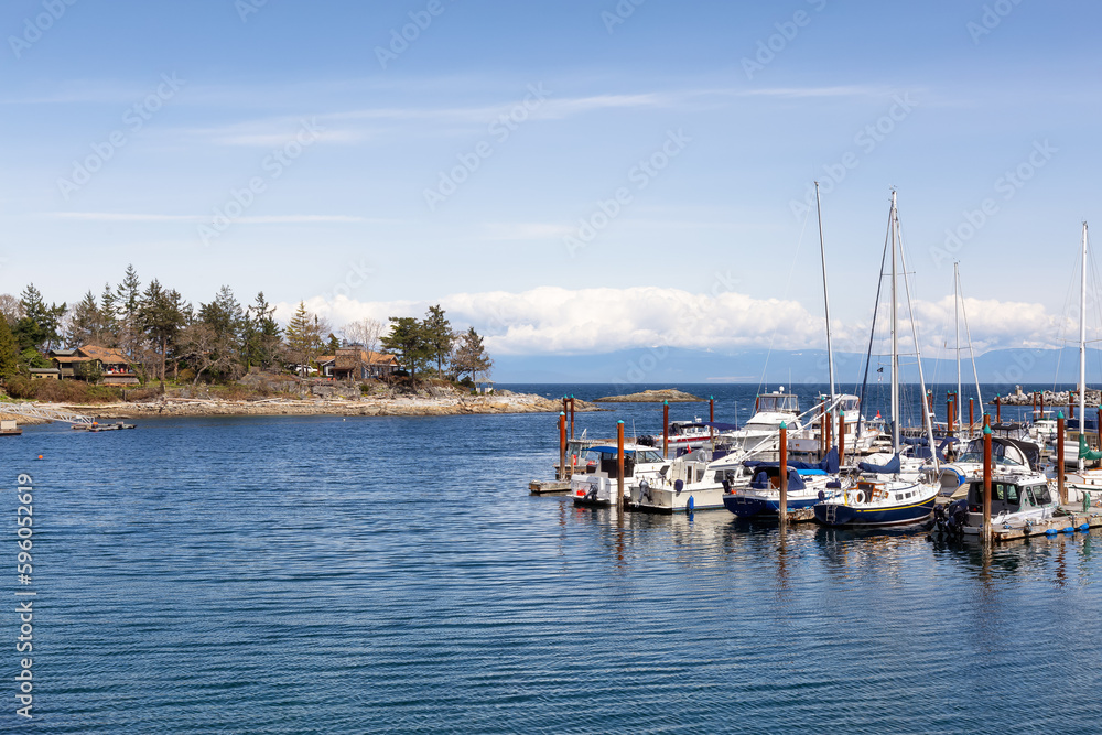 Sailboats in marina on the ocean shore. Nanoose Bay, Vancouver Island, British Columbia, Canada.