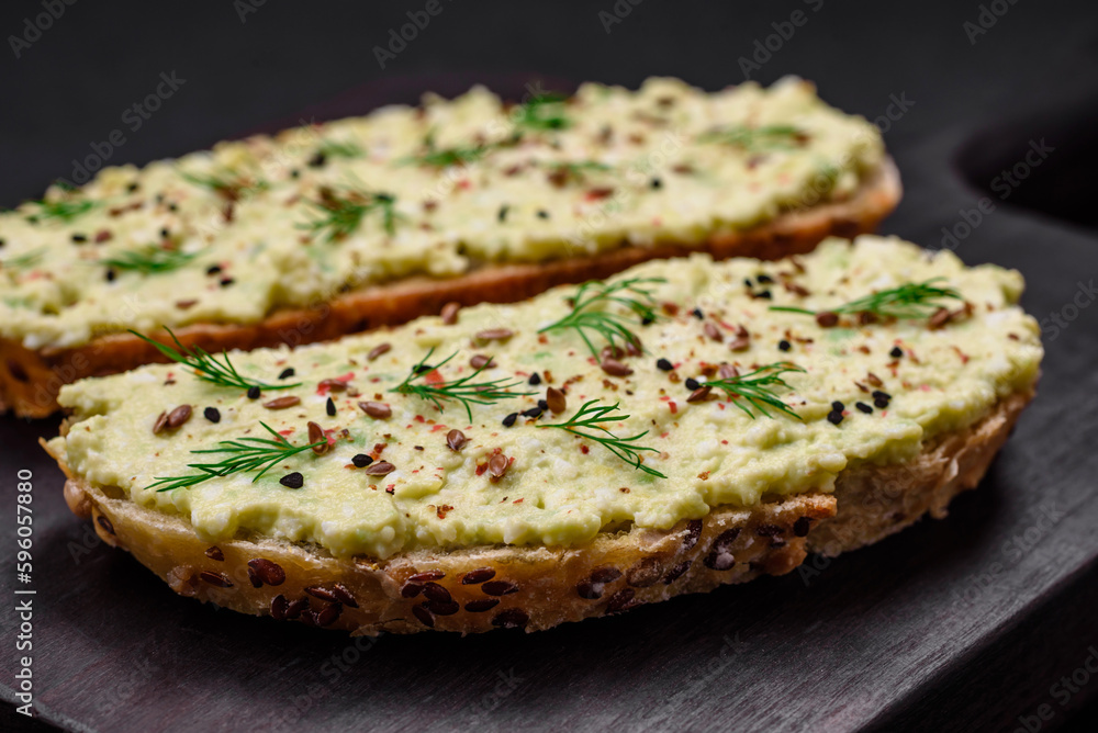 Grilled toast with avocado paste, eggs, cream cheese, salt, spices and herbs Grilled toast with avocado paste, eggs, cream cheese, salt, spices and herbs