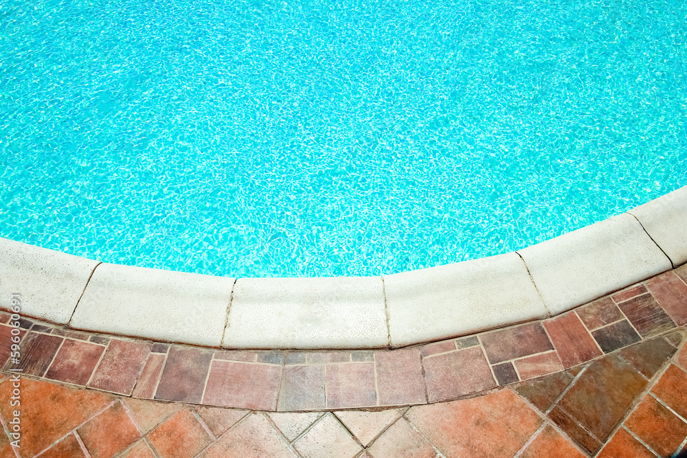 Obraz premium Beautiful swimming pool at the seaside hotel in park background