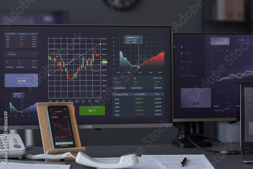 Close-up of financial graphs n monitors of computers to analyze stock market