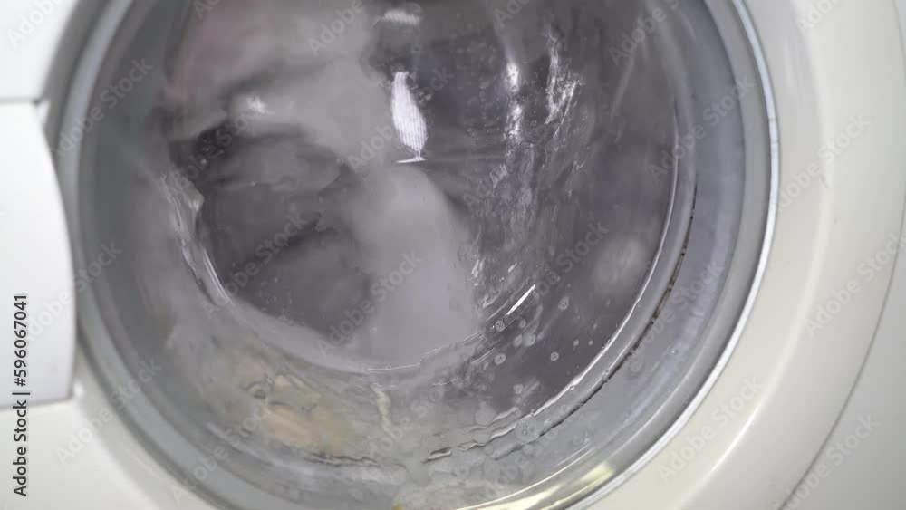 Washing dirty linen in the washing machine. Washing dirty linen in the washing machine.