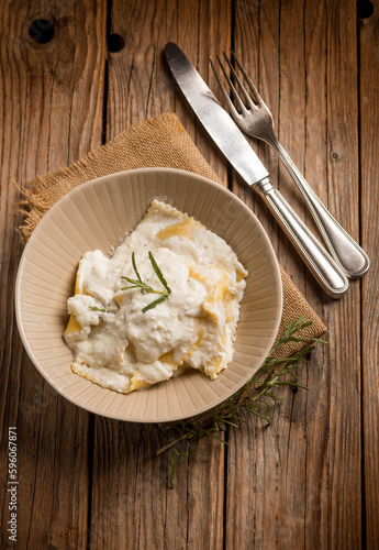 ravioli with parmesan cheese and herbs photo