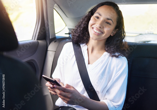 Getting from one place to the next has never been easier. an attractive young businesswoman sending a text while sitting in the backseat of a taxi. © Anela Ramba/peopleimages.com