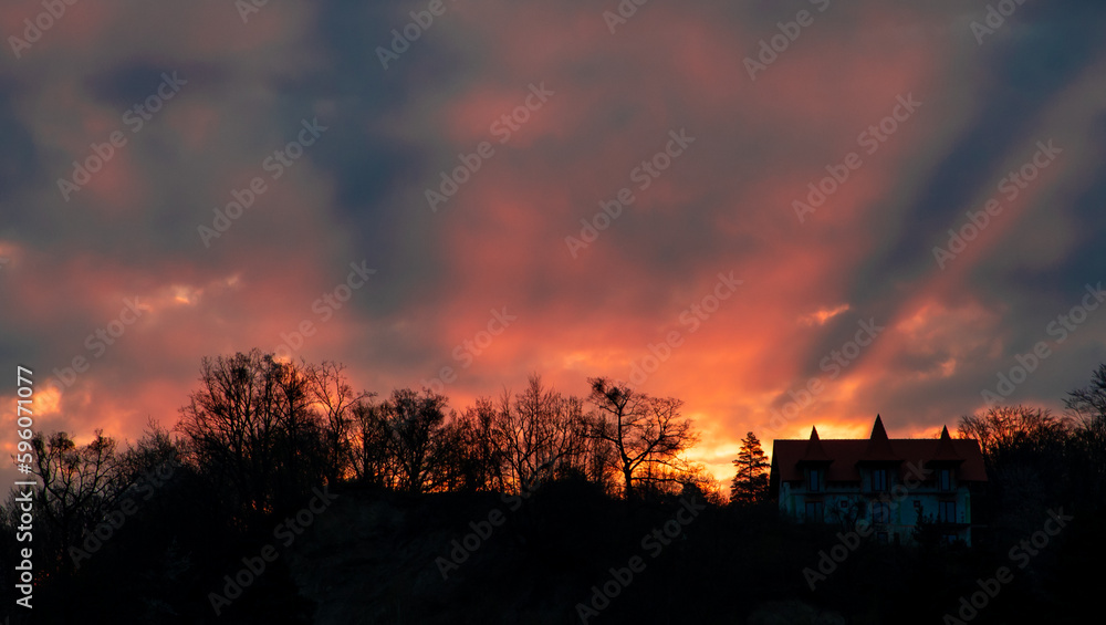 landscape of a house on a hill among trees in the morning at sunrise landscape of a house on a hill among trees in the morning at sunrise