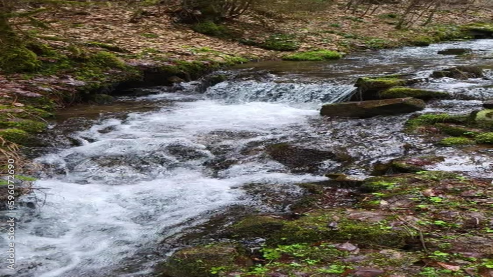 Beautiful spring stream waterfall in the forest of Carpathian mountains, Ukraine. Travel and vacation, water and nature Beautiful spring stream waterfall in the forest of Carpathian mountains, Ukraine. Travel and vacation, water and nature