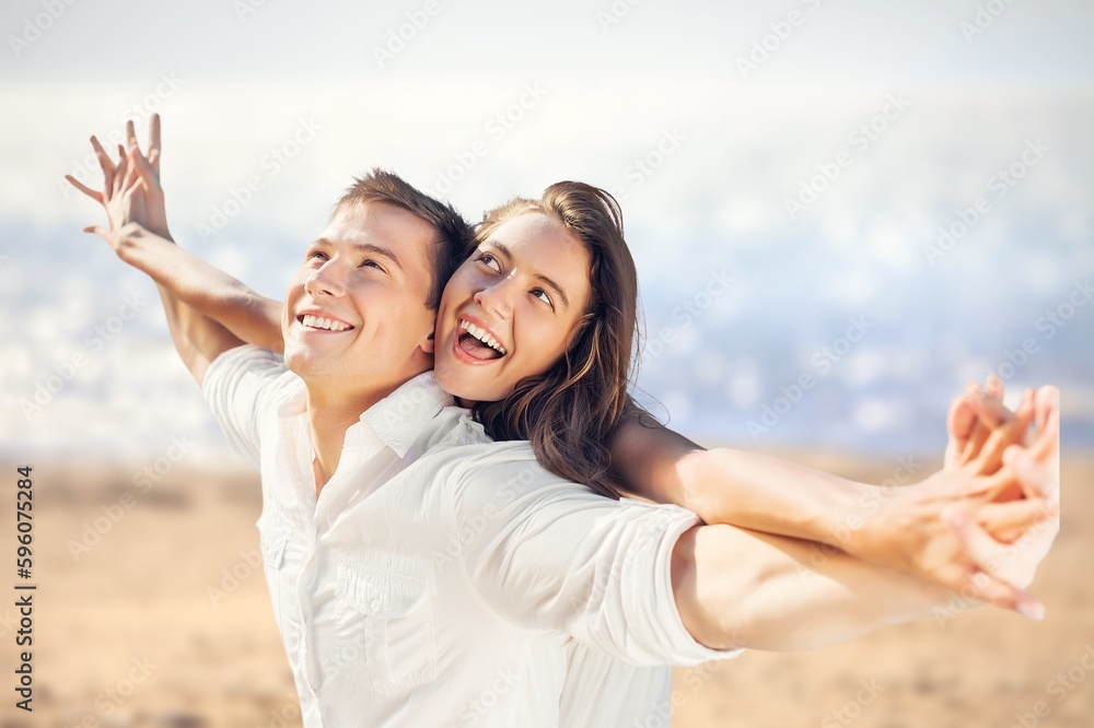 Happy beautiful couple on beach. have fun Happy beautiful couple on beach. have fun