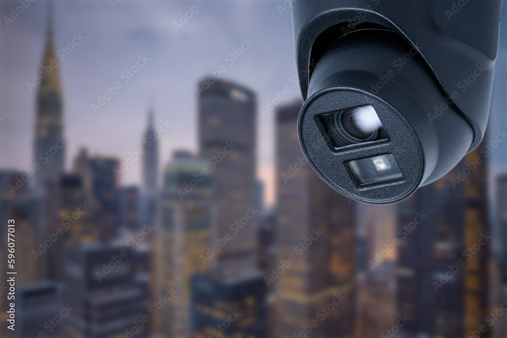 CCTV monitoring, security cameras. Backdrop with views of the city during twilight.