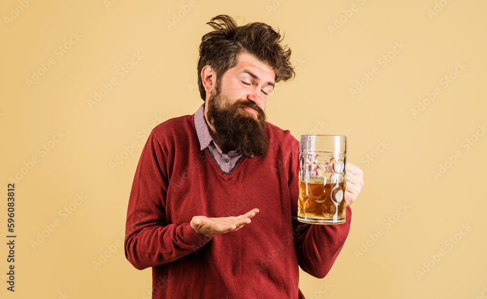 Celebration oktoberfest festival. Drunk man with craft beer mug. Man drinking draught beer at bar or pub. Bearded man with glass of delicious beer. Bearded hipster drinking beer. Alcohol and leisure. Celebration oktoberfest festival. Drunk man with craft beer mug. Man drinking draught beer at bar or pub. Bearded man with glass of delicious beer. Bearded hipster drinking beer. Alcohol and leisure.
