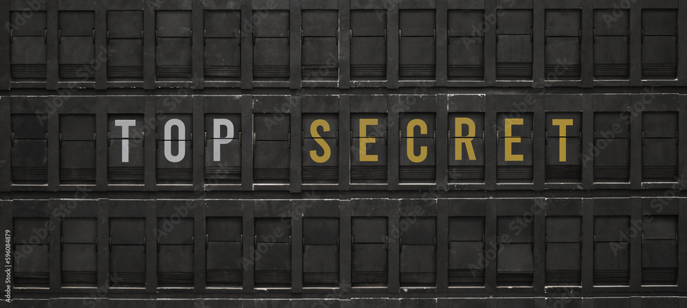 Fototapeta premium Flip board with text TOP SECRET