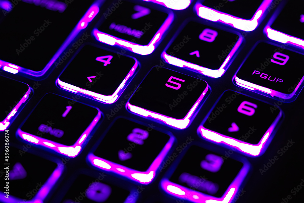 laptop keyboard numeric pad with purple lighting close-up